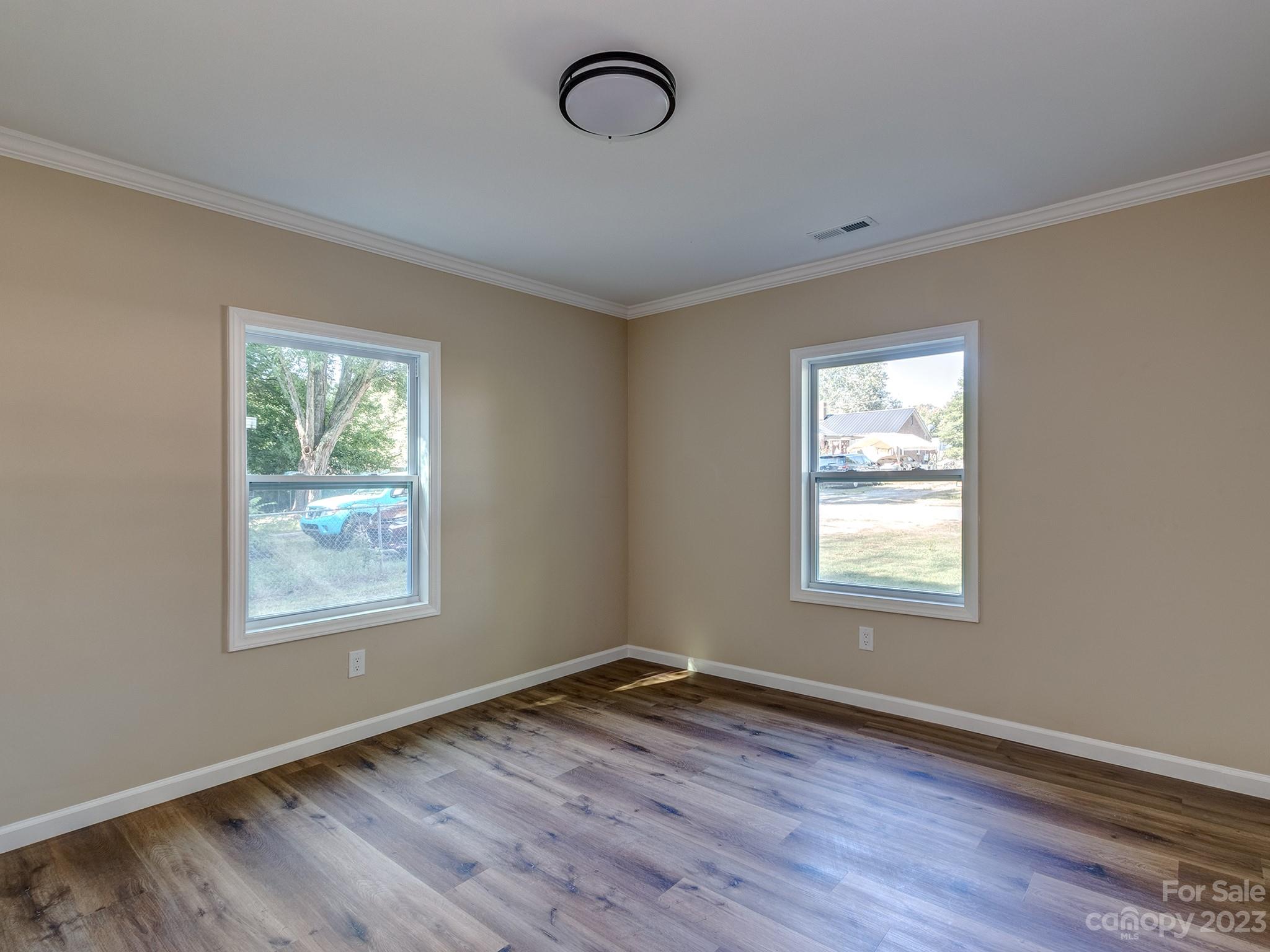 1031 State Rd S-29-424 Lancaster, SC 29720 - Photo 11 of 47 a view of an empty room with wooden floor and a window