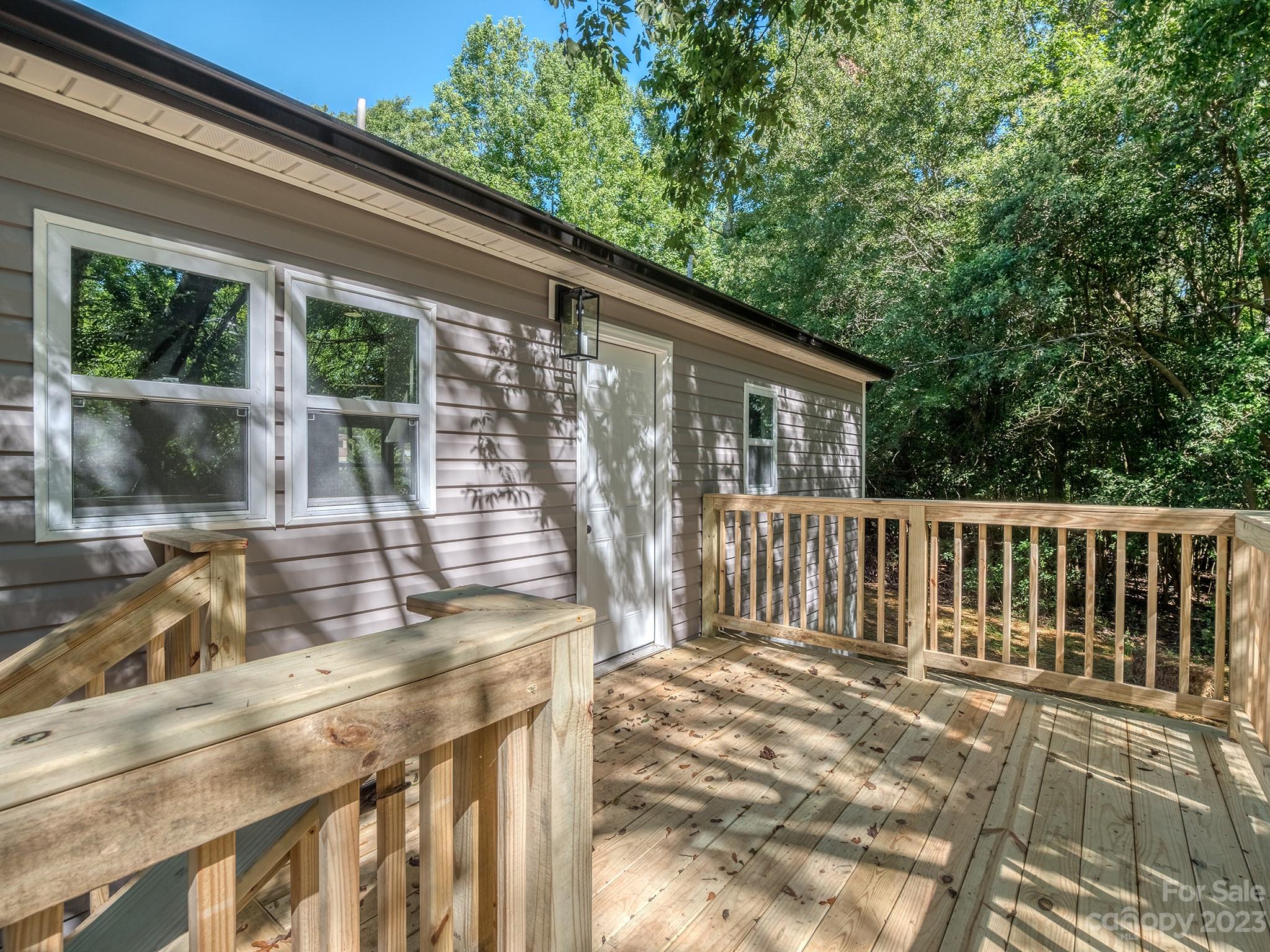 1031 State Rd S-29-424 Lancaster, SC 29720 - Photo 22 of 47 a view of backyard with large trees and wooden fence
