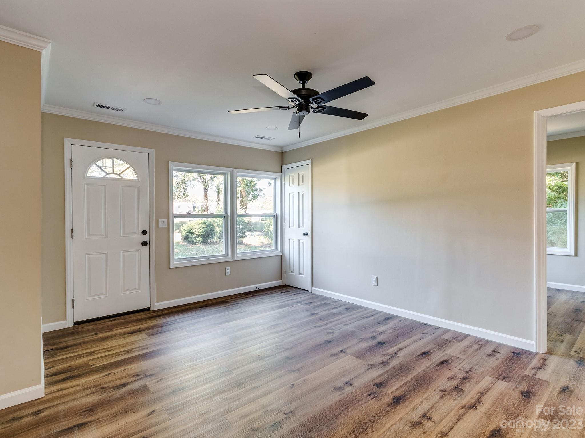 1031 State Rd S-29-424 Lancaster, SC 29720 - Photo 8 of 47 a view of empty room with wooden floor and fan