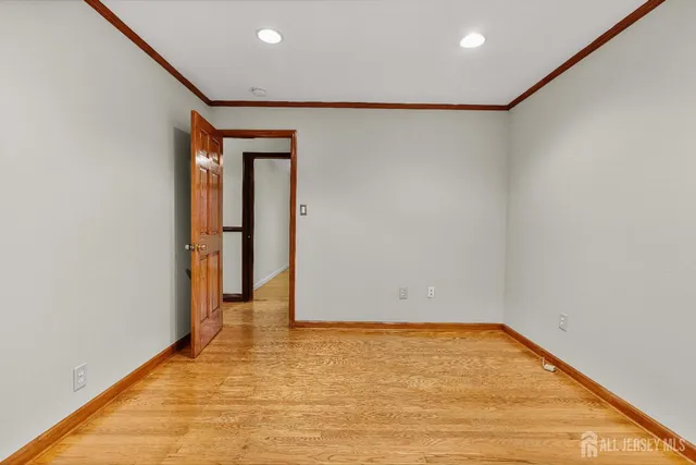 a view of hallway with wooden floor