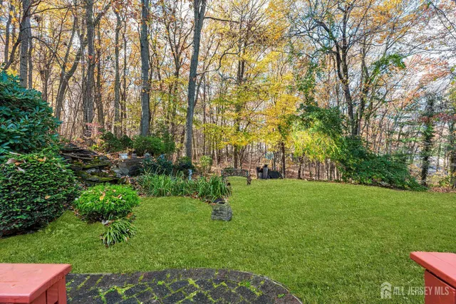 a view of a house with a yard porch and sitting area
