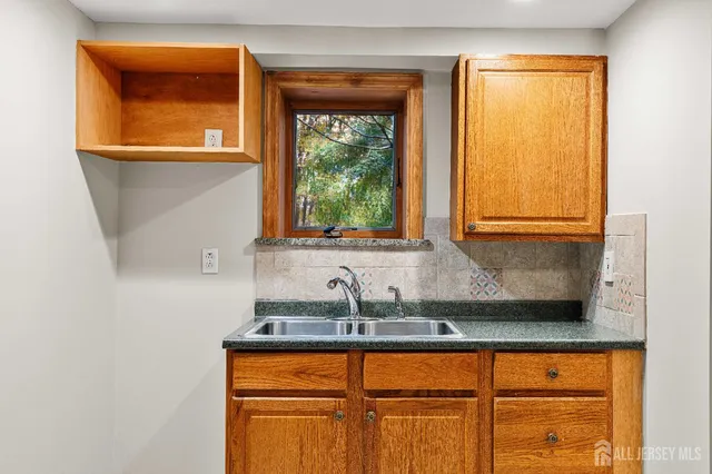 a bathroom with a sink and a window