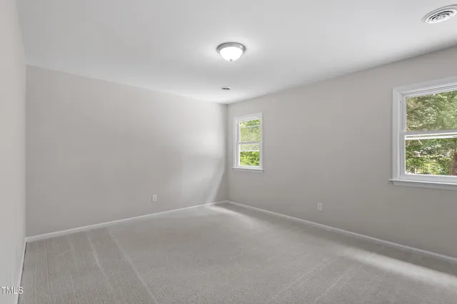 an empty room with windows