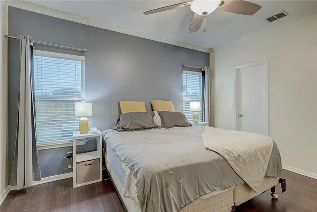 a bedroom with a bed and window