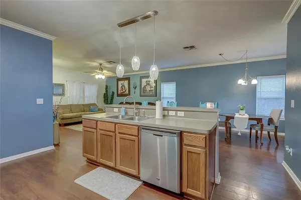 a kitchen with a sink and cabinets