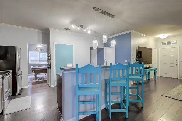 a view of kitchen with cabinets and wooden floor