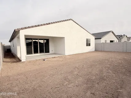 a view of a house with a backyard