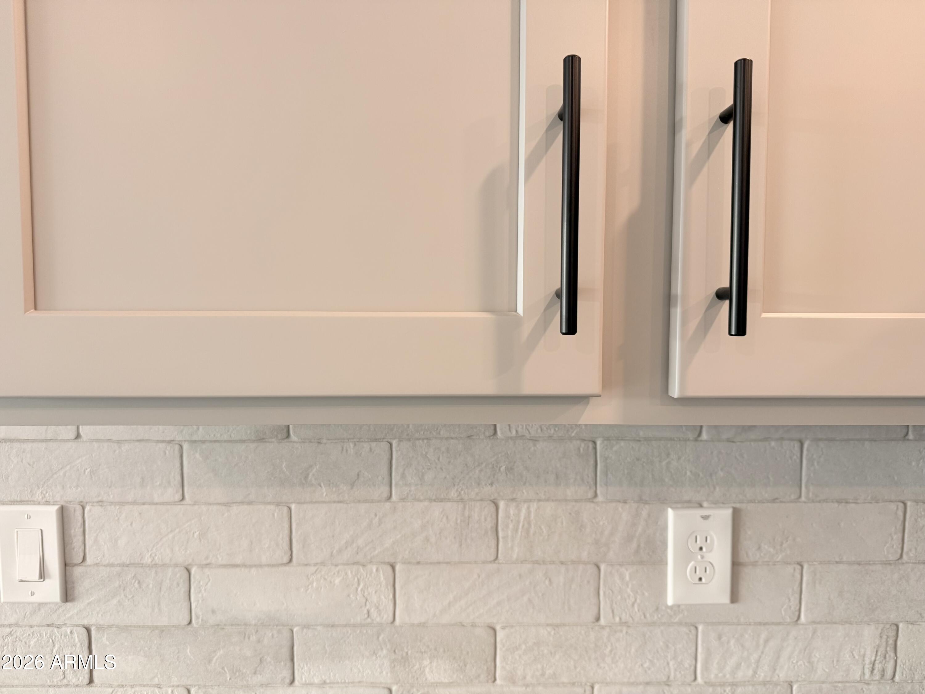 32148 Buckaroo Road San Tan Valley, AZ 85140 - Photo 23 of 45 a view of a kitchen with white cabinets