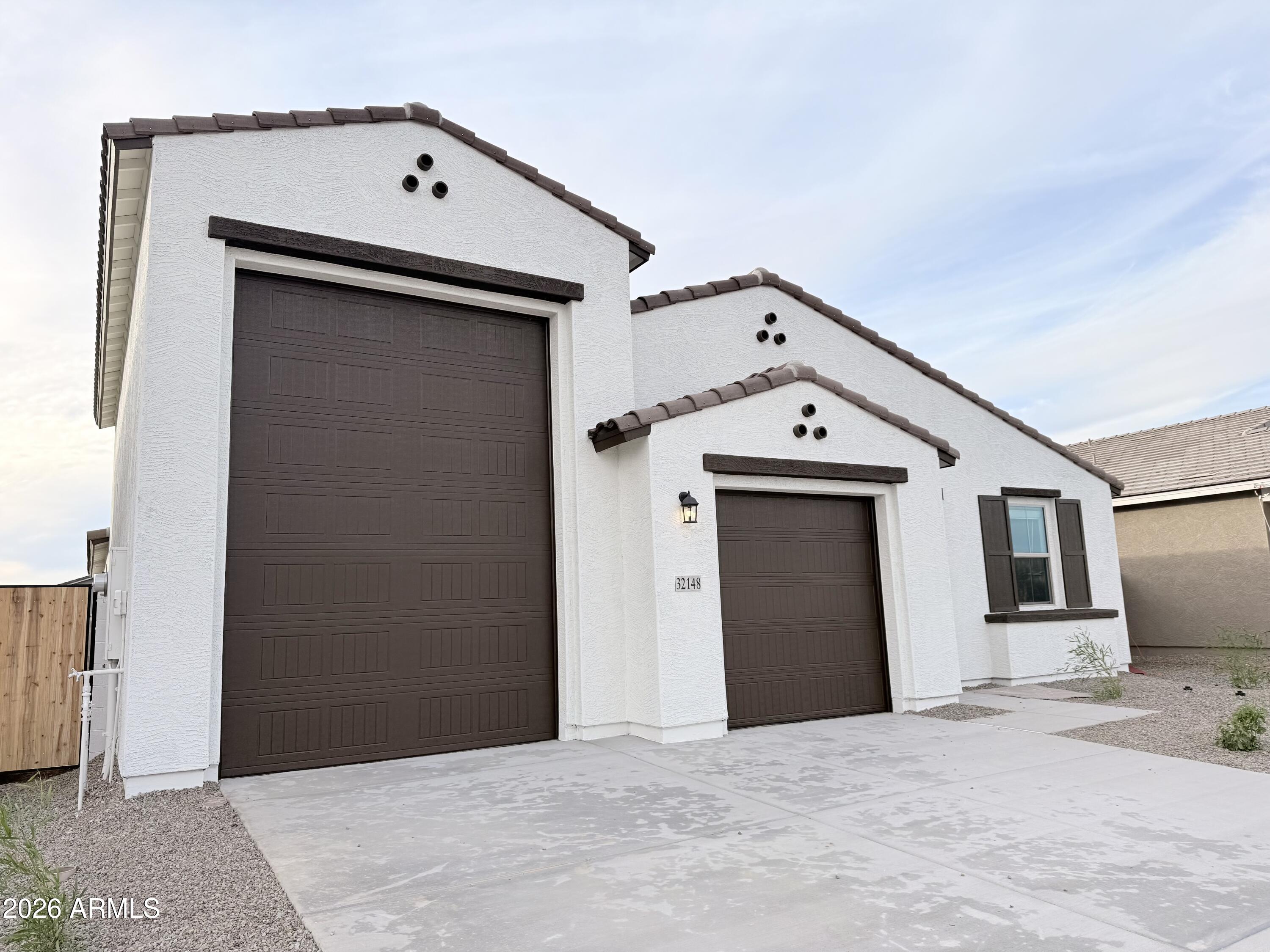 32148 Buckaroo Road San Tan Valley, AZ 85140 - Photo 3 of 45 a view of a garage