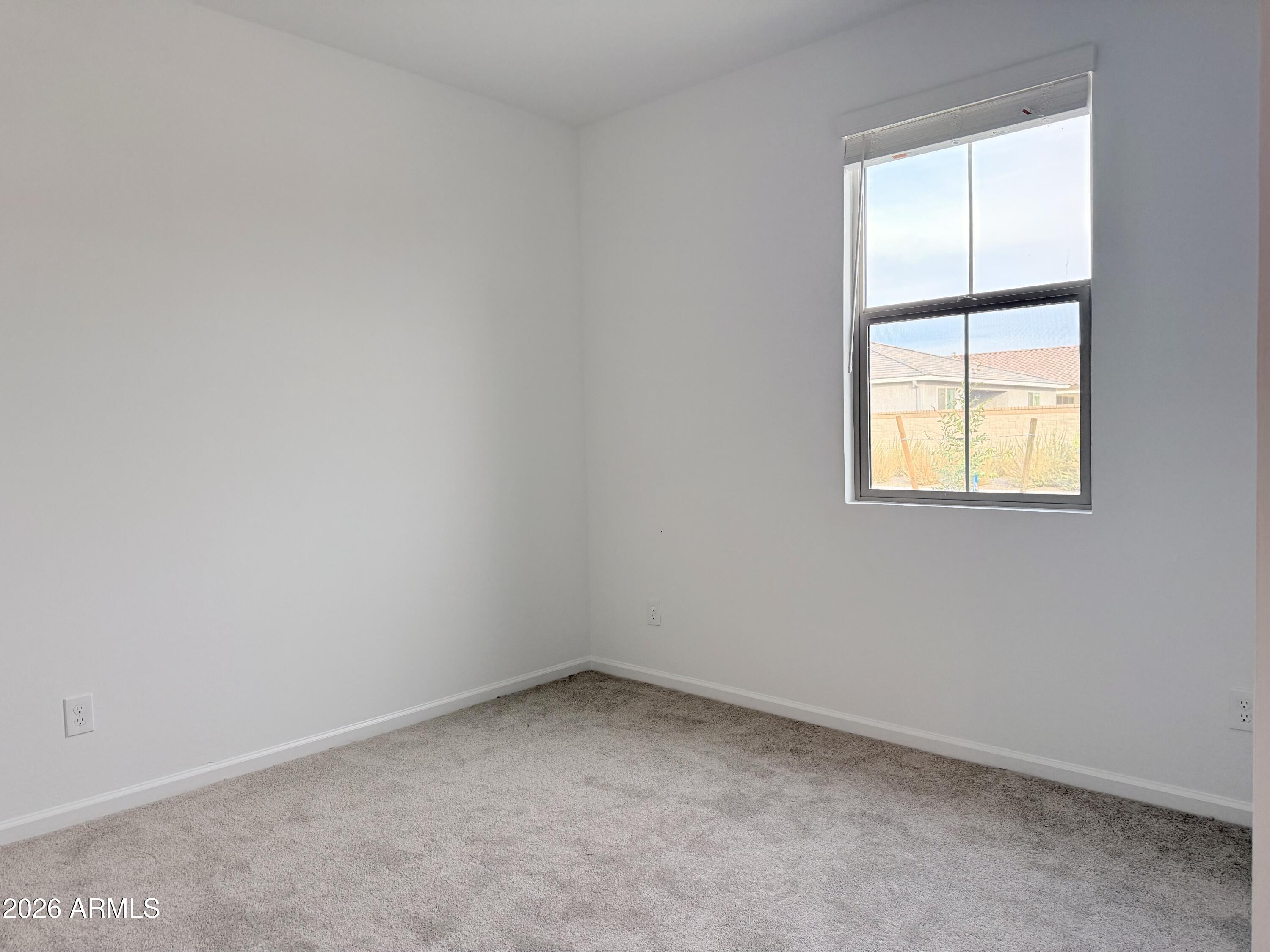 32148 Buckaroo Road San Tan Valley, AZ 85140 - Photo 7 of 45 an empty room with a window