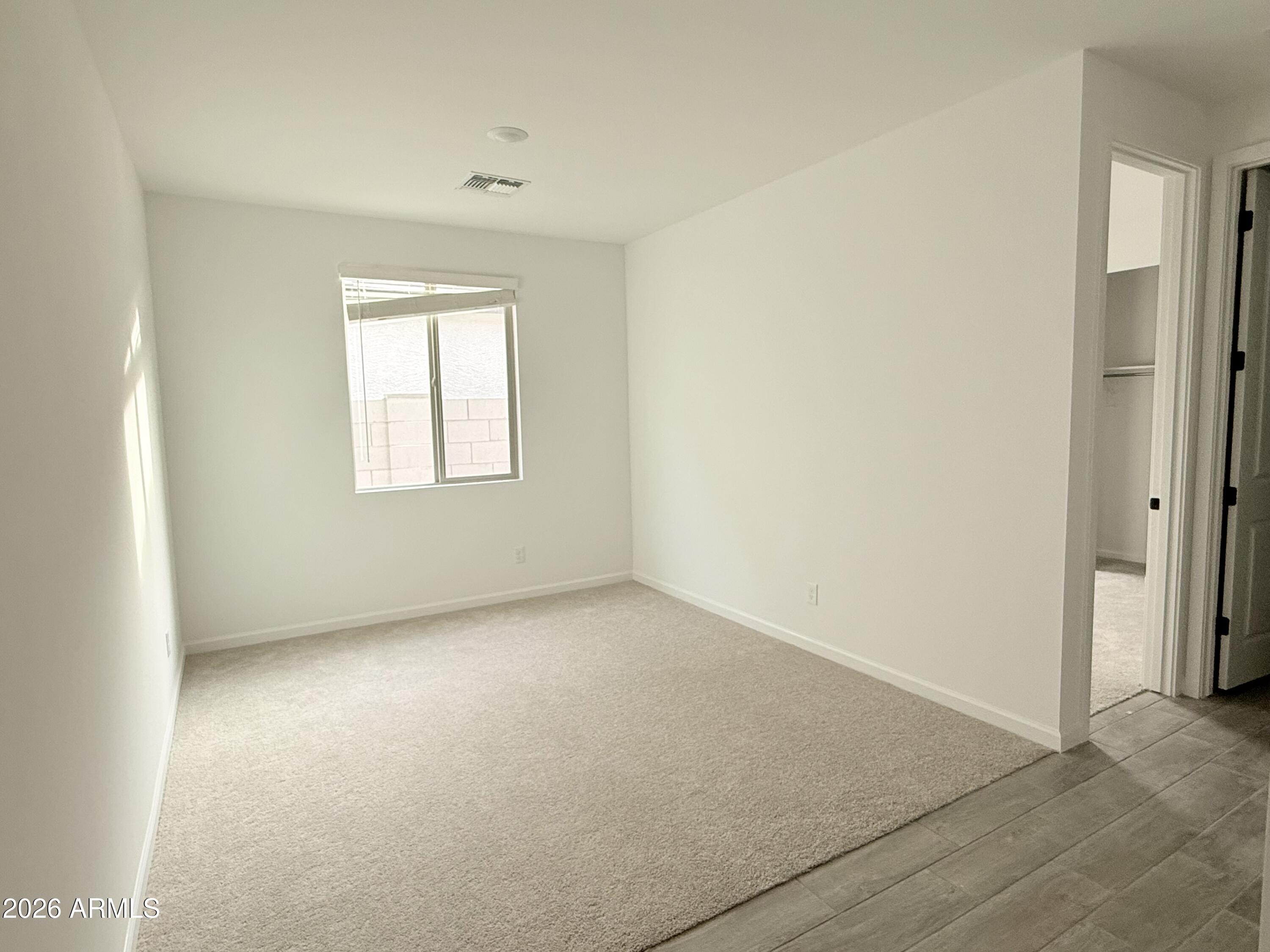 32148 Buckaroo Road San Tan Valley, AZ 85140 - Photo 10 of 45 an empty room with windows