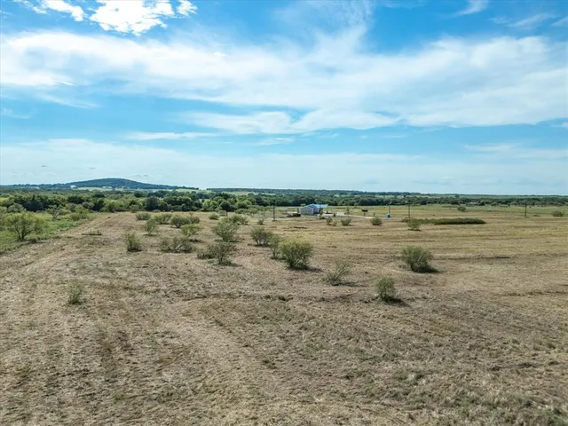 a view of a lake with beach and city view