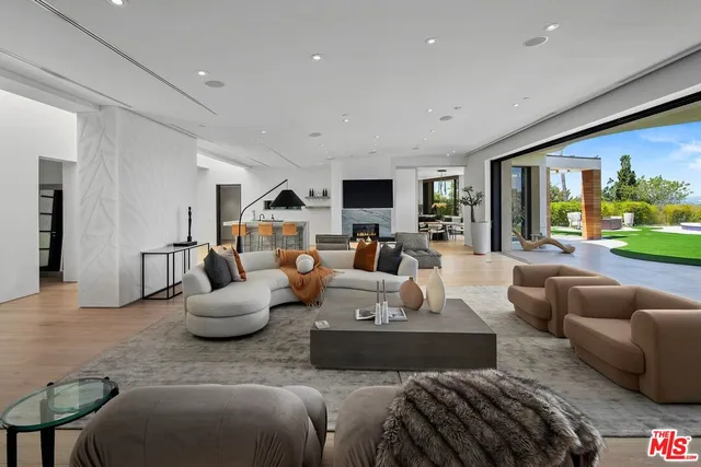 a kitchen with stainless steel appliances granite countertop a sink and a refrigerator