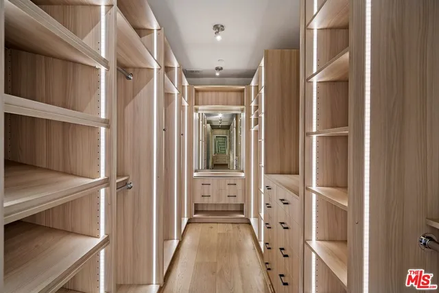 a large white room with a large window and white walls