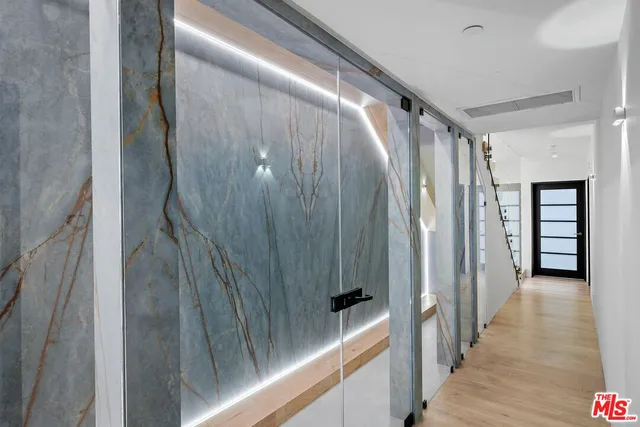 a view of a patio with table and chairs and potted plants