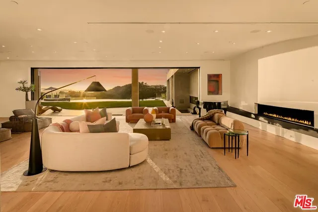 a living room with couches and a flat screen tv
