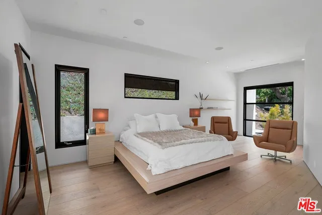 a view of a garden with lawn chairs