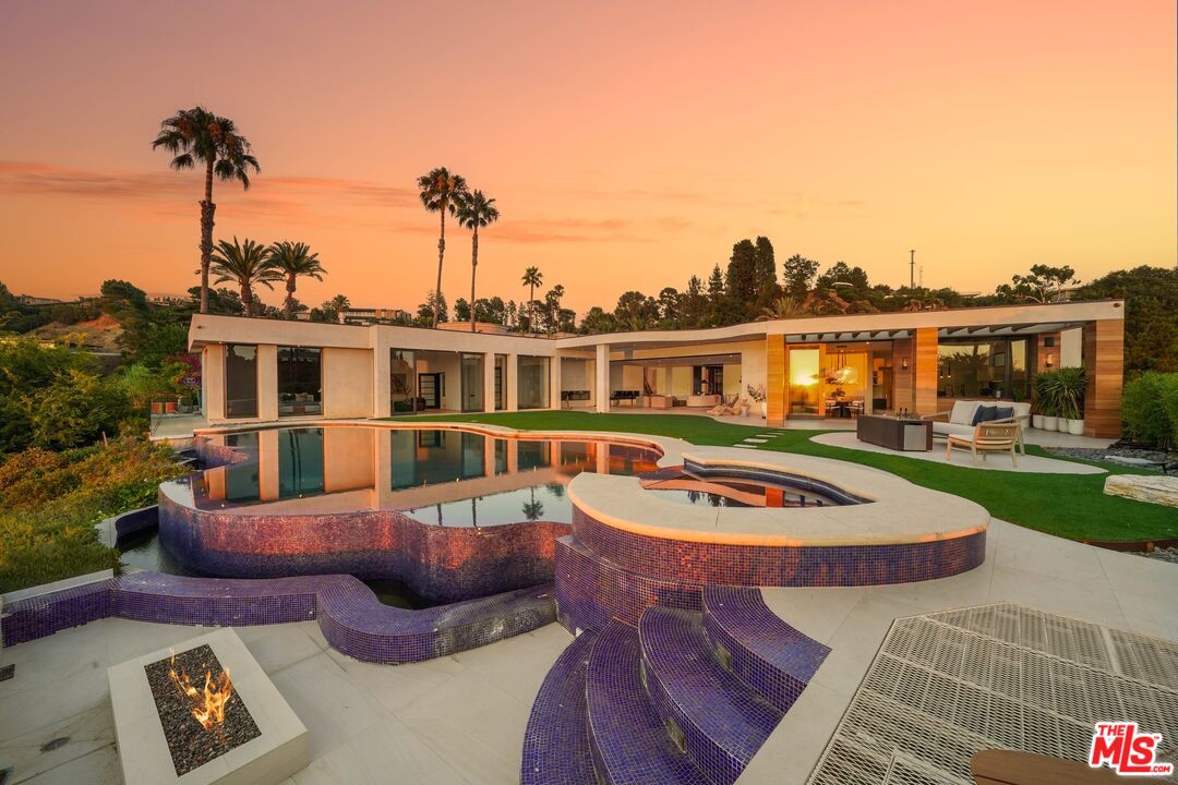 455 Castle Place Beverly Hills, CA 90210 - Photo 10 of 47 a view of a house with pool and chairs