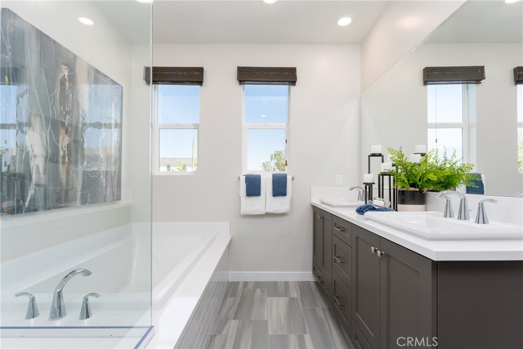 263 Siena Lake Forest, CA 92630 - Photo 15 of 51 a bathroom with a tub sink and mirror