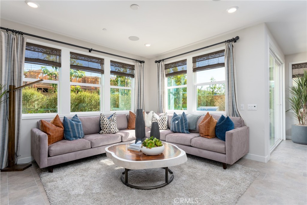 263 Siena Lake Forest, CA 92630 - Photo 2 of 51 a living room with furniture and a large window