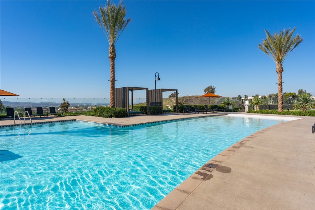 263 Siena Lake Forest, CA 92630 - Photo 37 of 51 a view of a swimming pool and a yard