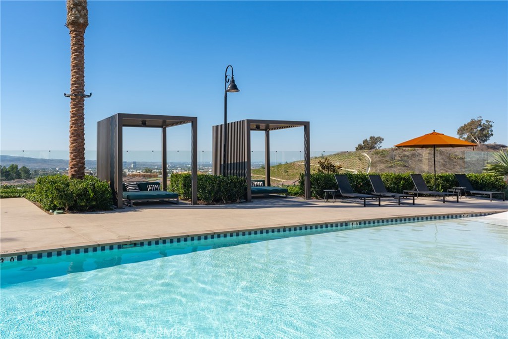 263 Siena Lake Forest, CA 92630 - Photo 39 of 51 a view of a swimming pool with a yard