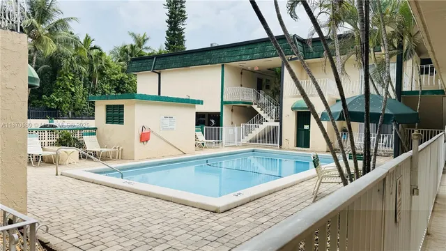 a hallway with a stove top oven a fireplace and a couch