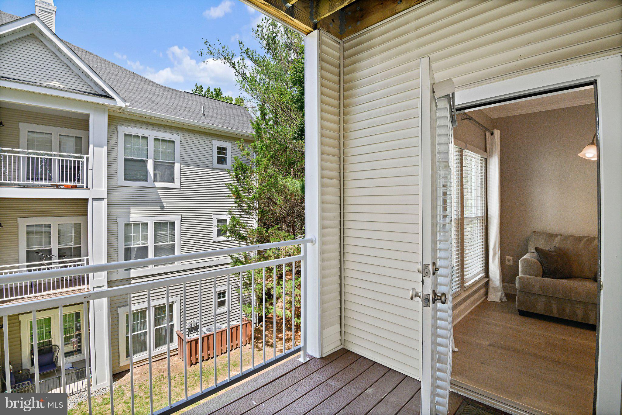 1519 North Point Drive, Unit 202 Reston, VA 20194 - Photo 38 of 49 Sunny balcony with serene views.
