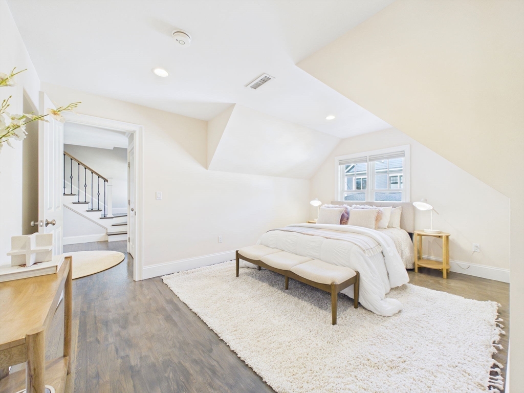 36 Troy Lane Newton, MA 02468 - Photo 12 of 42 a bedroom with a bed and a table