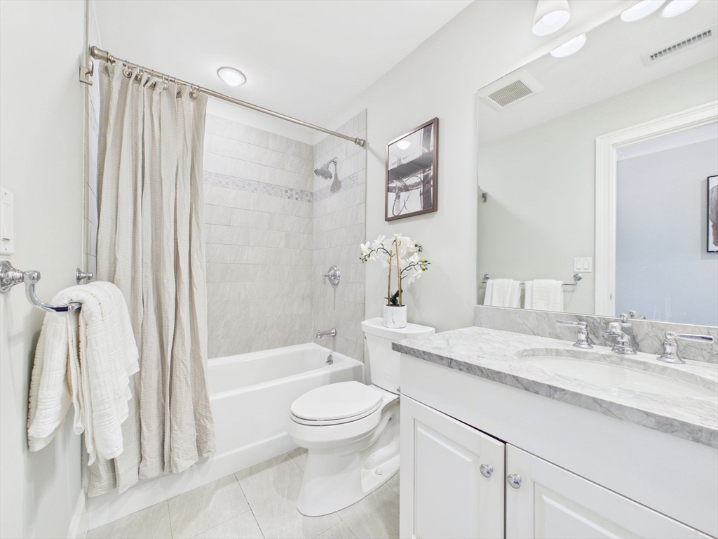 36 Troy Lane Newton, MA 02468 - Photo 14 of 42 a bathroom with a granite countertop sink toilet and shower