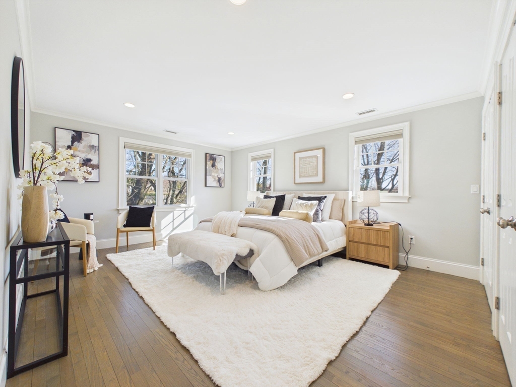 36 Troy Lane Newton, MA 02468 - Photo 15 of 42 a spacious bedroom with a large bed and a couch