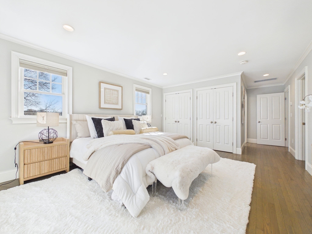 36 Troy Lane Newton, MA 02468 - Photo 16 of 42 a spacious bedroom with a bed and a couch