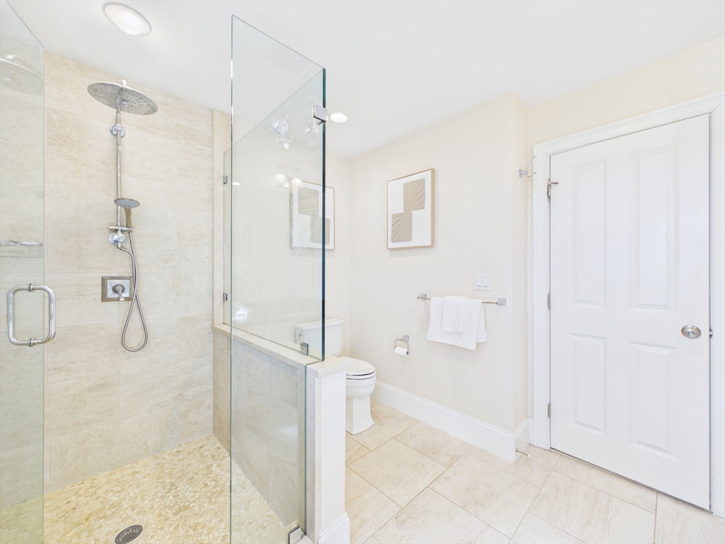 36 Troy Lane Newton, MA 02468 - Photo 19 of 42 a bathroom with a shower and a toilet