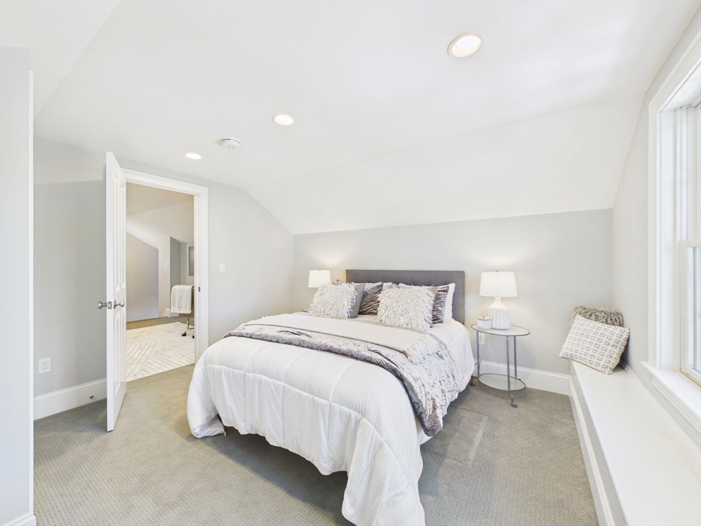 36 Troy Lane Newton, MA 02468 - Photo 25 of 42 a bedroom with a bed and a lamp