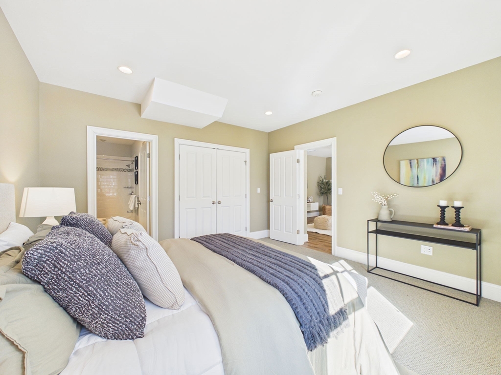 36 Troy Lane Newton, MA 02468 - Photo 31 of 42 a bedroom with a bed a mirror and a window