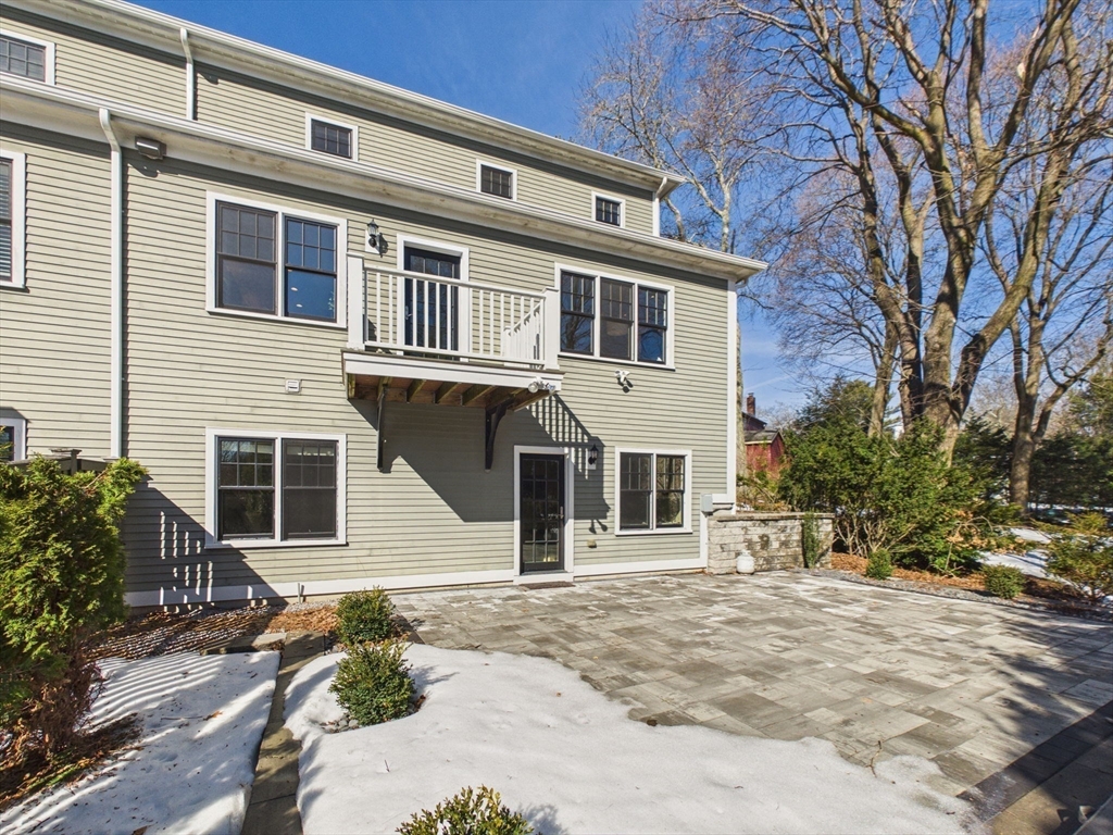 36 Troy Lane Newton, MA 02468 - Photo 34 of 42 a front view of a house with a yard