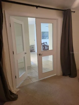 a bedroom with furniture and a window