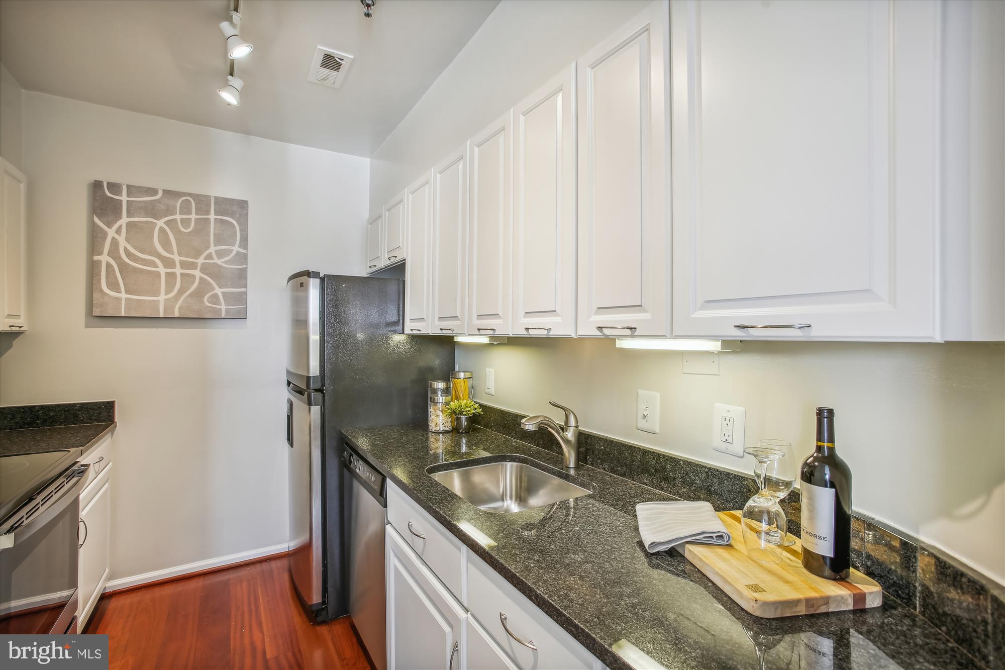 1619 R Street Northwest, Unit 603 Washington, DC 20009 - Photo 7 of 31 Kitchen with Stainless Appliances
