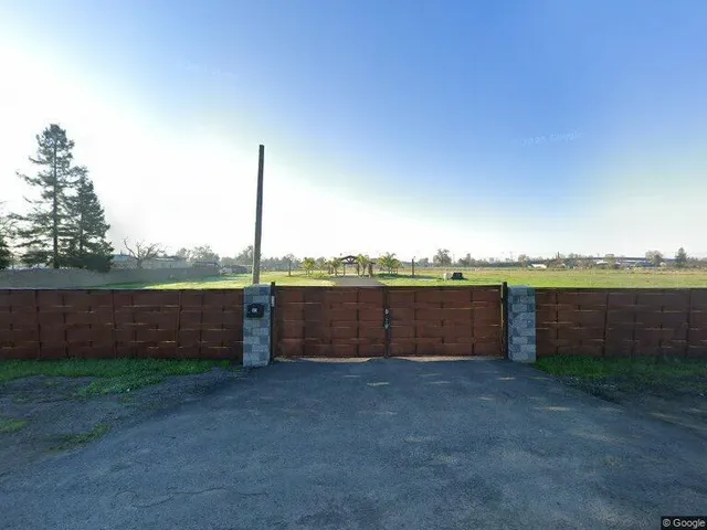 a view of a barn with a yard