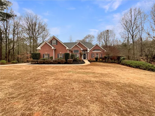 a view of house with yard in front of it