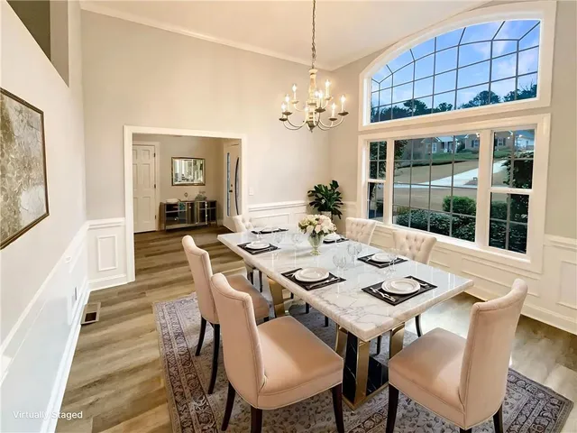 a view of a dining room with furniture window and wooden floor