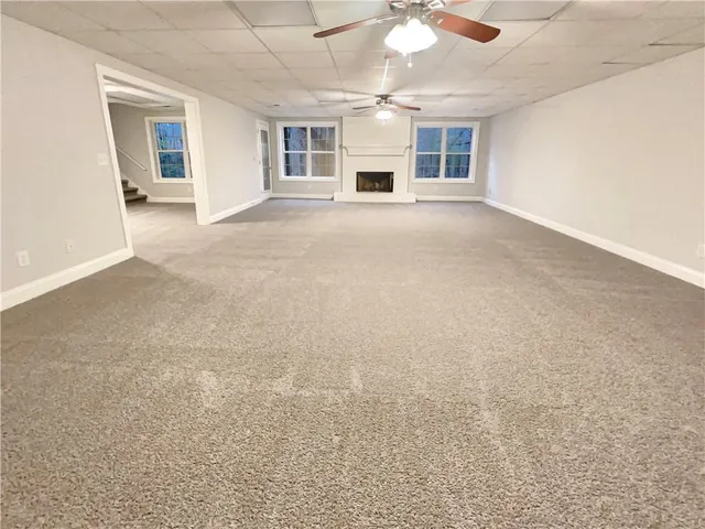 a view of a livingroom with a kitchen