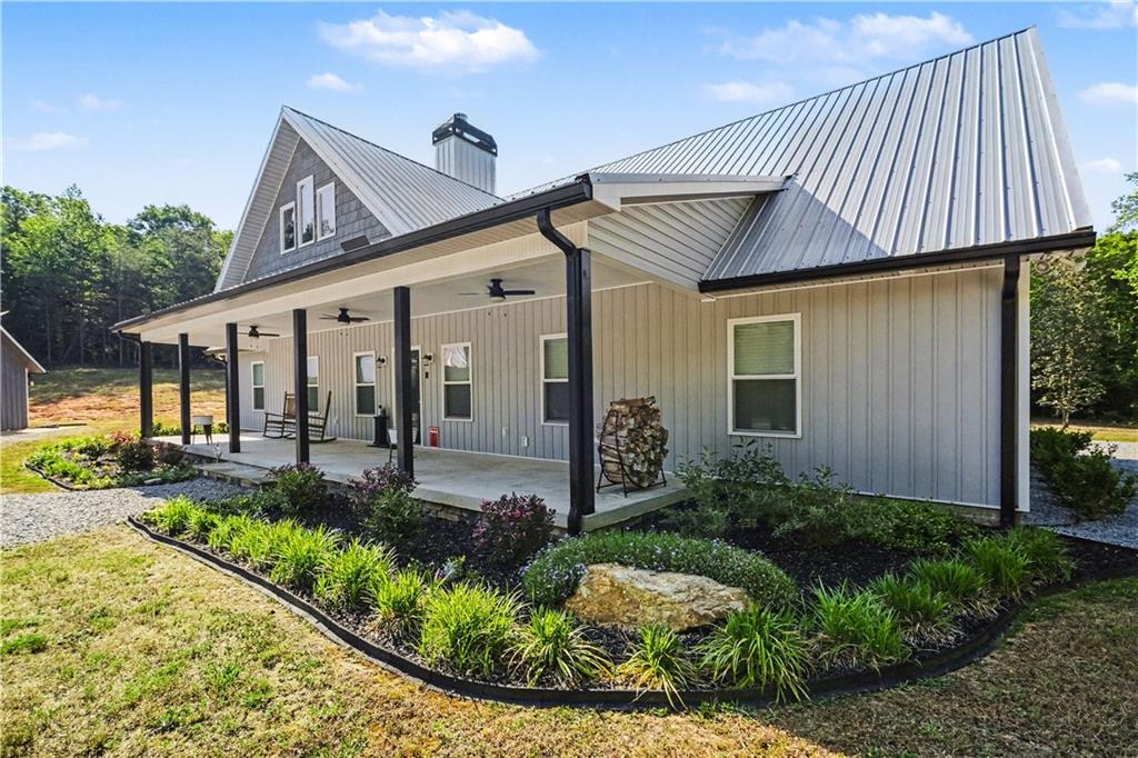 1596 Kirk-Langford Road Danielsville, GA 30633 - Photo 1 of 37 a front view of a house with garden