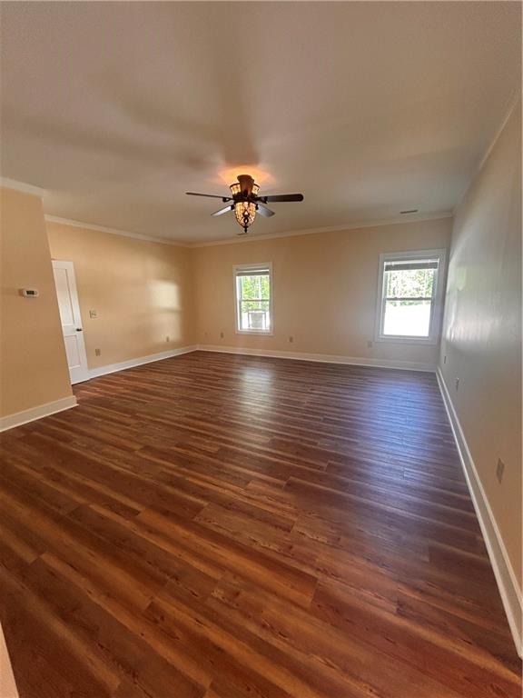 1596 Kirk-Langford Road Danielsville, GA 30633 - Photo 12 of 37 wooden floor in an empty room with a window