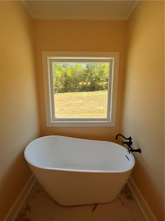 1596 Kirk-Langford Road Danielsville, GA 30633 - Photo 14 of 37 a bathroom with a granite countertop sink and a window