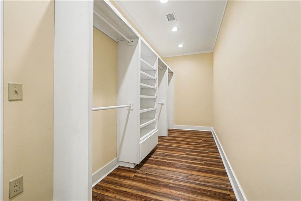 1596 Kirk-Langford Road Danielsville, GA 30633 - Photo 15 of 37 a view of a hallway with wooden floor and staircase