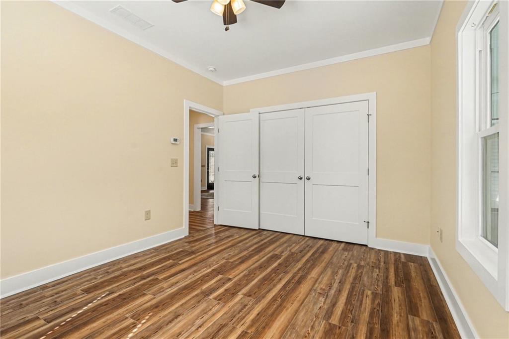 1596 Kirk-Langford Road Danielsville, GA 30633 - Photo 19 of 37 wooden floor in an empty room