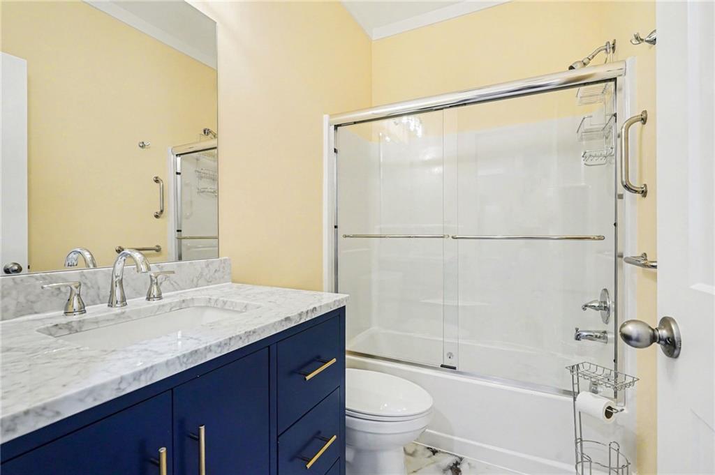 1596 Kirk-Langford Road Danielsville, GA 30633 - Photo 20 of 37 a bathroom with a granite countertop sink mirror toilet and bathtub