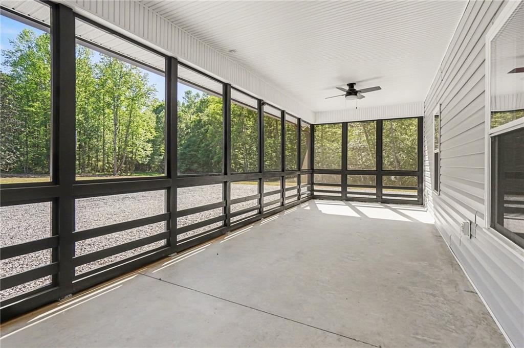1596 Kirk-Langford Road Danielsville, GA 30633 - Photo 22 of 37 a view of an empty room with windows
