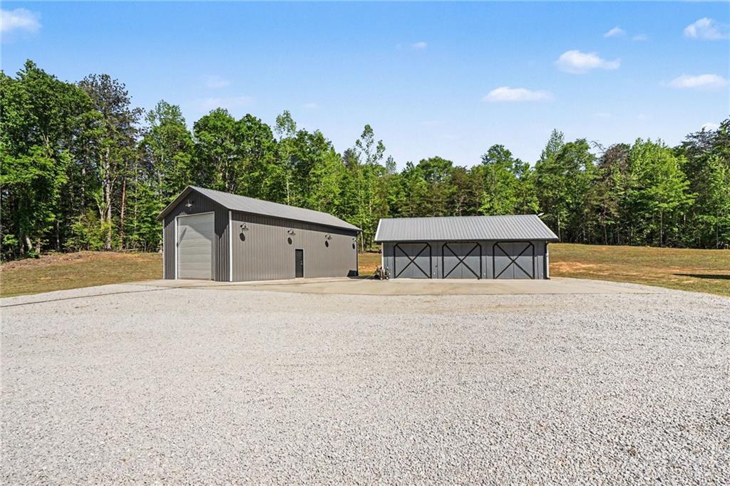 1596 Kirk-Langford Road Danielsville, GA 30633 - Photo 23 of 37 a front view of house with yard and trees in the background